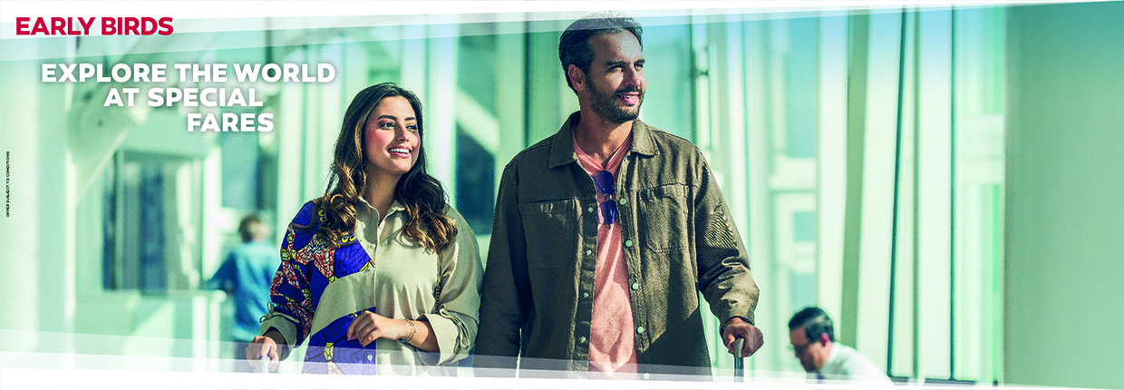 Travellers walking through an airport terminal